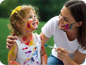 Parent and child painting together